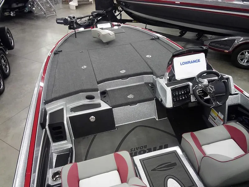 Slide: The Image of 2025 Triton 20XP Patriot boat interior with Lowrance electronics and seating. - 10