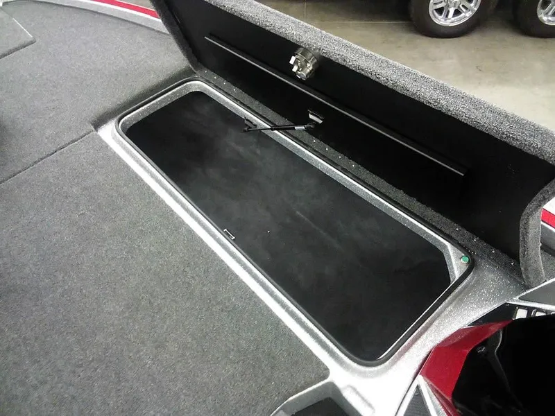 Slide: The Image of 2025 Triton 20XP Patriot boat storage compartment, open and empty. - 13