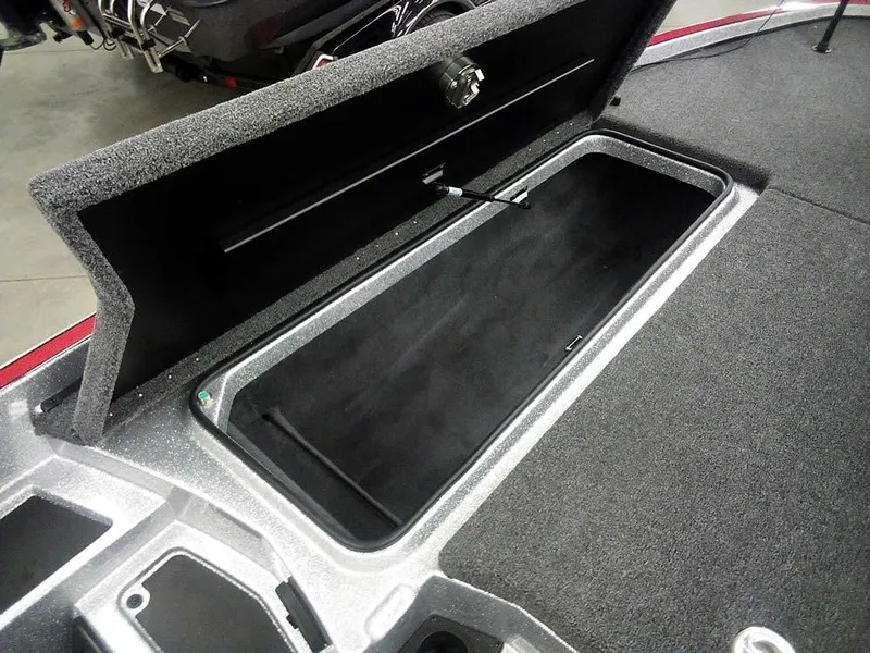 Slide: The Image of Open storage compartment in 2025 Triton 20XP Patriot boat. - 15