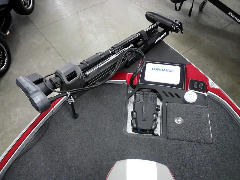 Slide: The Image of 2025 Triton 20XP Patriot boat deck with Lowrance electronics and trolling motor. - 17