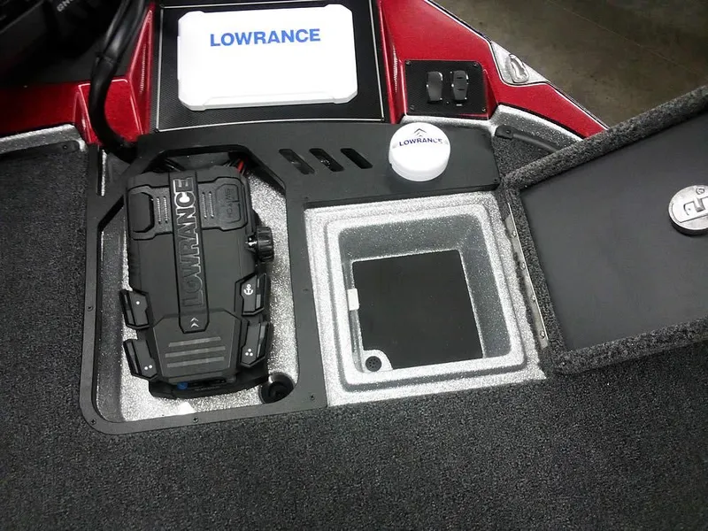 Slide: The Image of Triton 20XP Patriot 2025 boat dashboard with Lowrance electronics and storage compartments. - 18