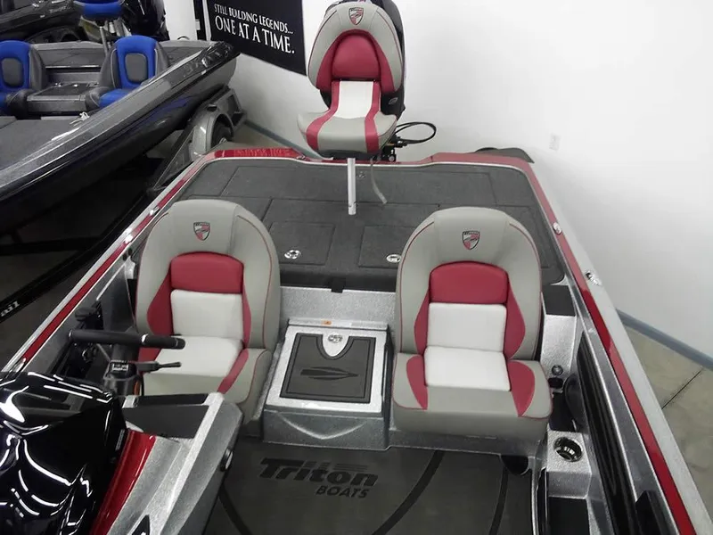 Slide: The Image of 2025 Triton 20XP Patriot boat interior with red and gray seating. - 20