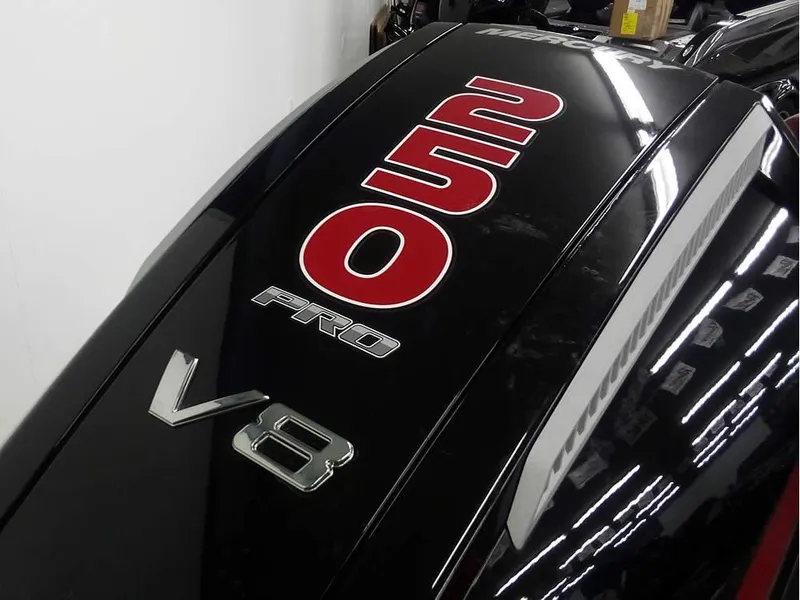 Slide: The Image of 2025 Triton 20XP Patriot V8 engine cover with bold red and silver lettering. - 30