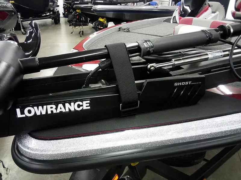 Slide: The Image of Triton 20XP Patriot 2025 with Lowrance Ghost trolling motor in a showroom. - 7