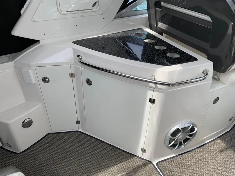 Slide: The Image of 2014 Monterey 320 Sport Yacht interior with sleek cabinetry and modern design. - 20