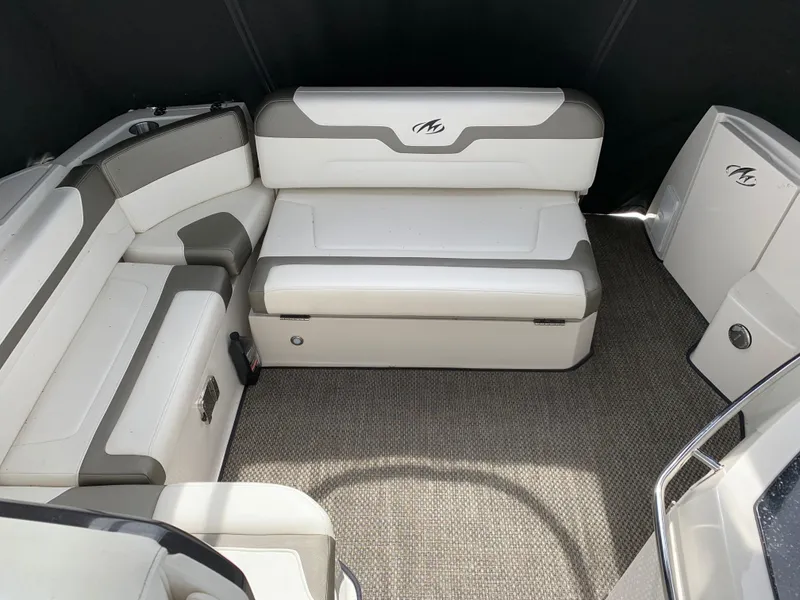 Slide: The Image of 2014 Monterey 320 Sport Yacht interior with white and gray seating, carpeted floor. - 21