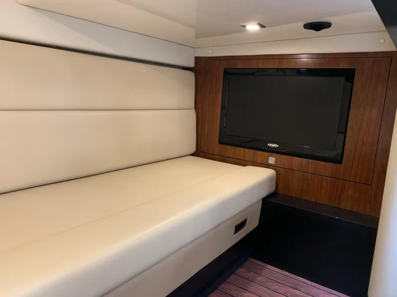 Slide: The Image of Interior of 2014 Monterey 320 Sport Yacht with beige seating and wall-mounted TV. - 40