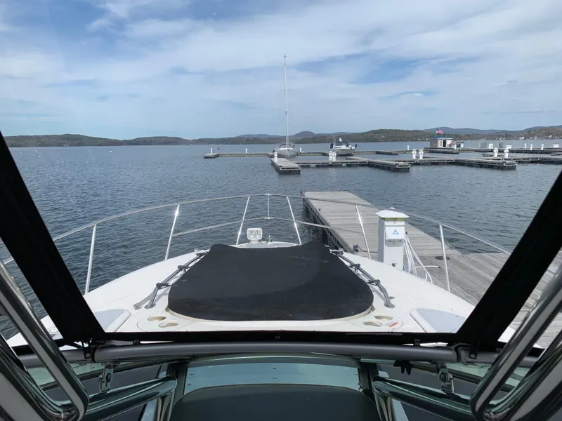 Slide: The Image of 2014 Monterey 320 Sport Yacht docked at a scenic marina. - 44
