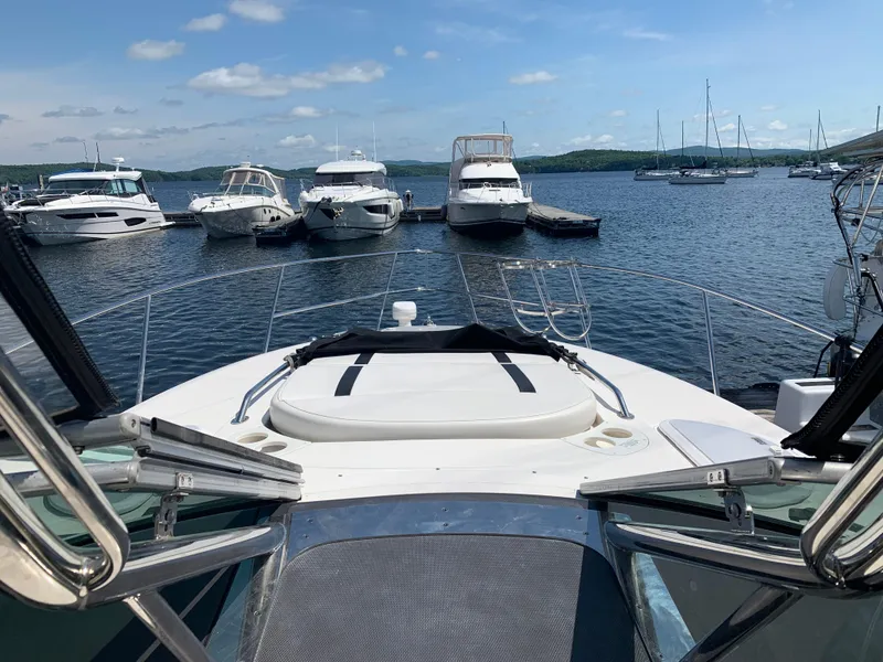 Slide: The Image of 2014 Monterey 320 Sport Yacht docked at a marina with other boats. - 6