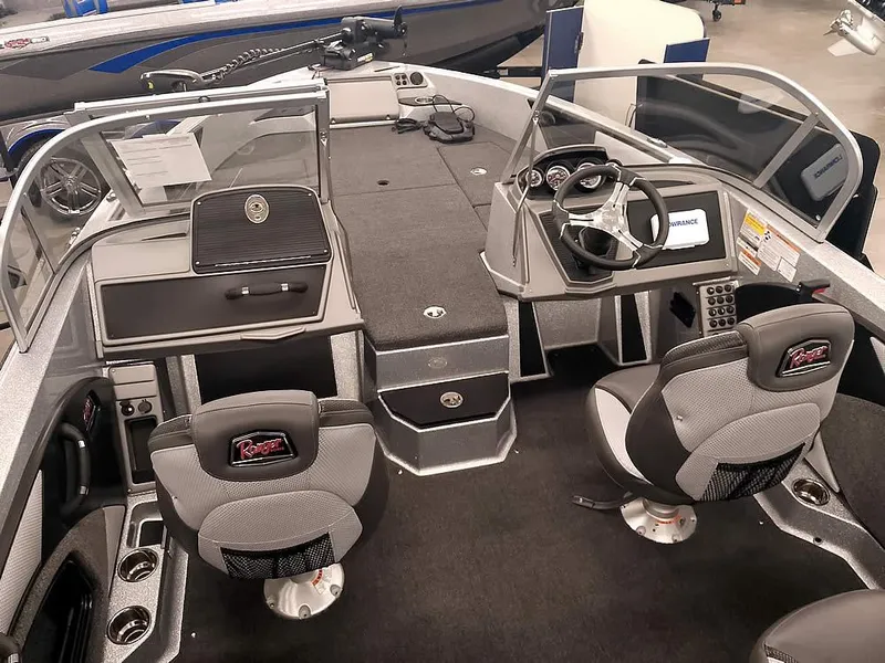 Slide: The Image of 2025 Ranger 1880MS Angler boat interior with dual seats and modern dashboard. - 10