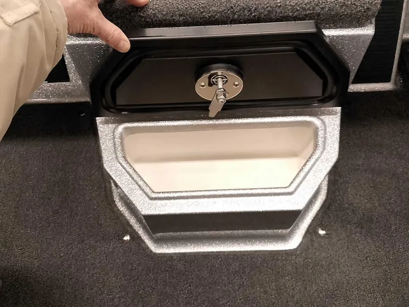 Slide: The Image of 2025 Ranger 1880MS Angler boat storage compartment with lock and key. - 12