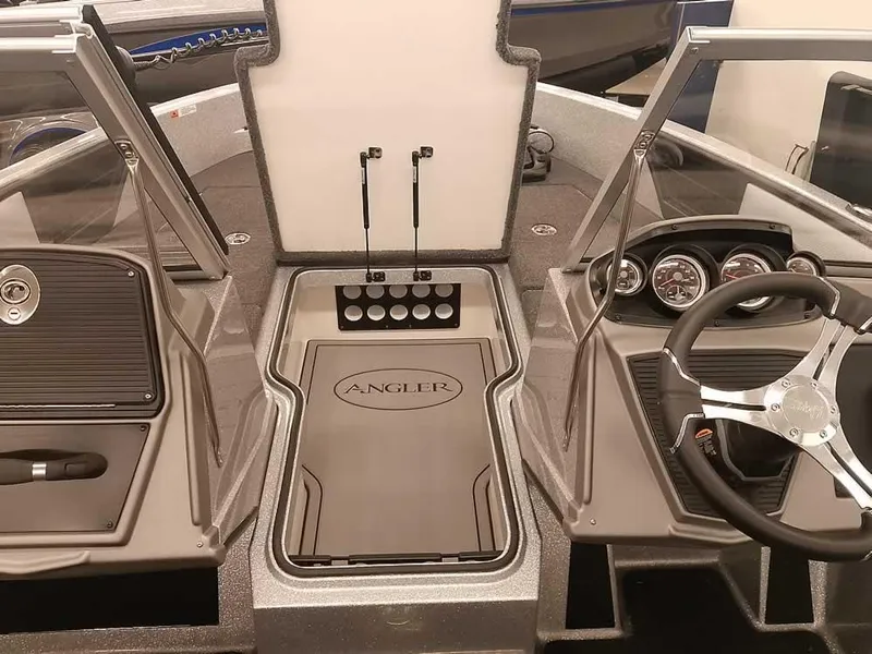 Slide: The Image of 2025 Ranger 1880MS Angler boat interior with steering wheel and dashboard controls. - 13