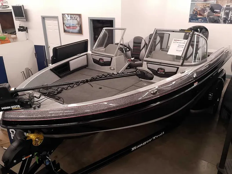 Slide: The Image of 2025 Ranger 1880MS Angler boat in showroom, featuring sleek design and modern equipment. - 2