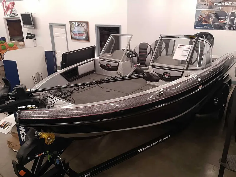 Slide: The Image of 2025 Ranger 1880MS Angler boat in showroom, featuring sleek design and modern equipment. - 37