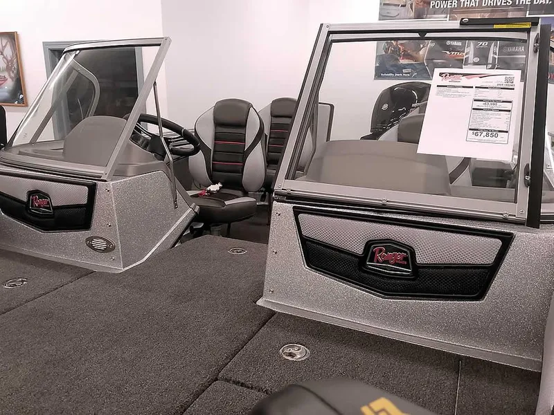 Slide: The Image of 2025 Ranger 1880MS Angler boat interior with dual consoles and seating. - 8