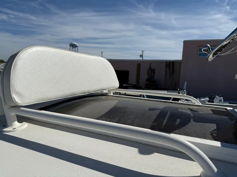 Slide: The Image of 2014 Ranger 2310 Bay boat seat and railing under clear blue sky. - 10
