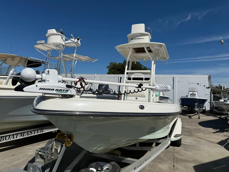 Slide: The Image of 2014 Ranger 2310 Bay boat on trailer, equipped with Minn Kota trolling motor. - 2