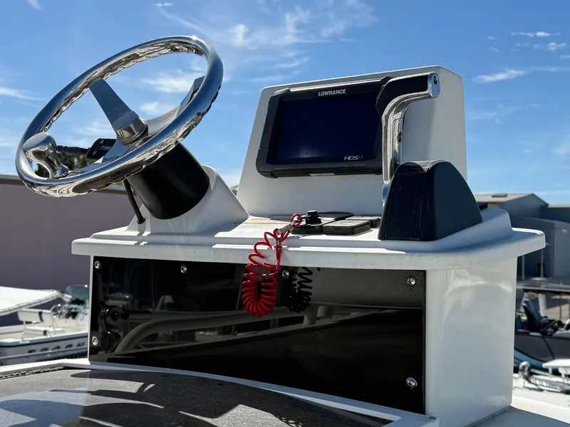 Slide: The Image of 2014 Ranger 2310 Bay boat console with steering wheel and navigation system. - 9