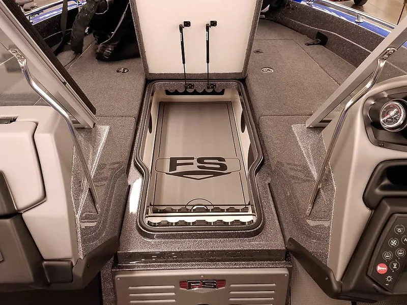 Slide: The Image of 2025 Ranger 620FS Fisherman boat interior with storage compartment and control panel. - 12
