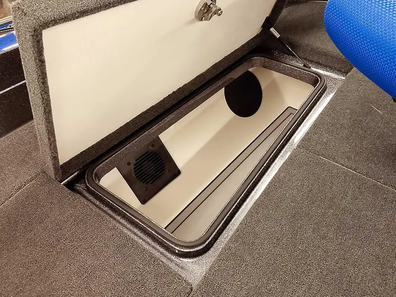 Slide: The Image of 2025 Ranger 620FS Fisherman boat storage compartment with open lid, showcasing interior space. - 16