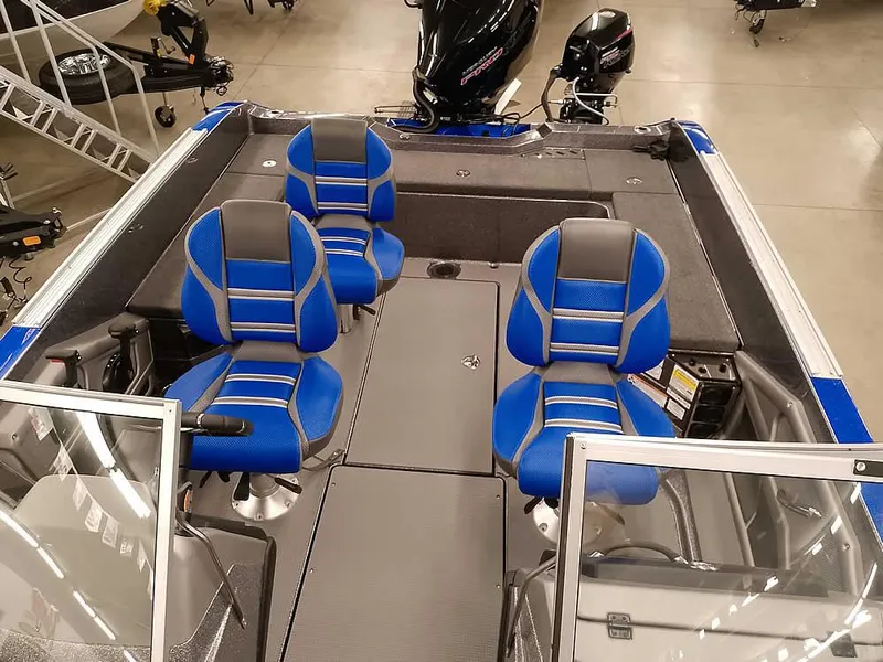 Slide: The Image of 2025 Ranger 620FS Fisherman boat interior with blue and gray seating. - 17