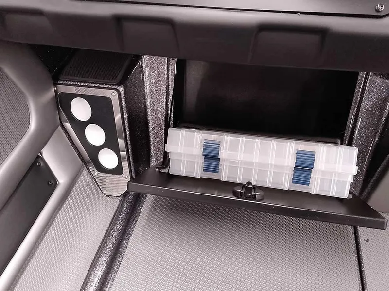 Slide: The Image of 2025 Ranger 620FS Fisherman boat storage compartment with organized tackle box. - 19