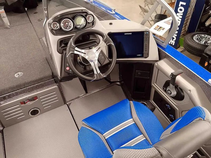 Slide: The Image of 2025 Ranger 620FS Fisherman boat interior with steering wheel and navigation system. - 23