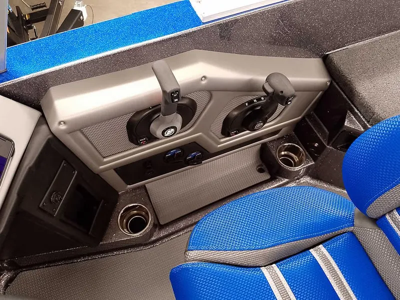 Slide: The Image of 2025 Ranger 620FS Fisherman boat interior with blue seating and control panel. - 24