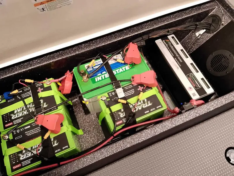 Slide: The Image of Battery compartment of 2025 Ranger 620FS Fisherman boat with multiple batteries and wiring. - 32