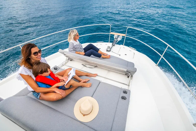 Slide: The Image of People relaxing on the deck of a 2026 Beneteau Swift Trawler 41 Fly. - 3