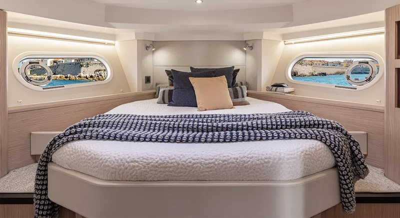 Slide: The Image of Luxurious bedroom in 2026 Beneteau Swift Trawler 41 Fly yacht, featuring elegant design and ocean views. - 6