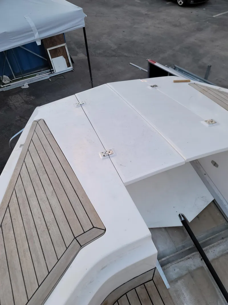 Slide: The Image of 2022 Catamaran PRJ Cat40 deck with wood accents, viewed from above. - 10