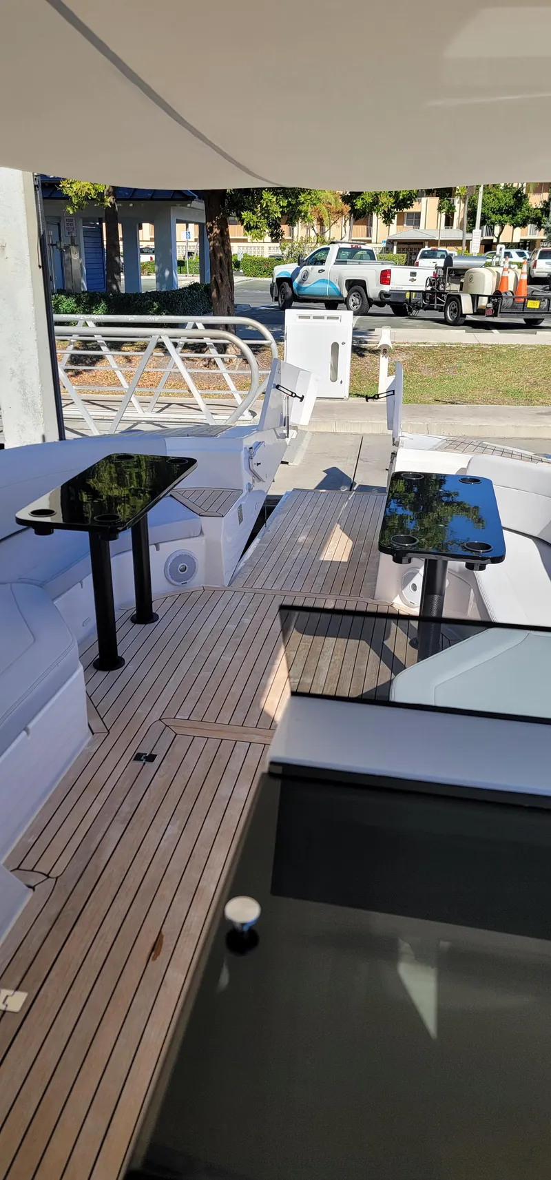 Slide: The Image of 2022 Catamaran PRJ Cat40 deck with modern seating and sleek design. - 11