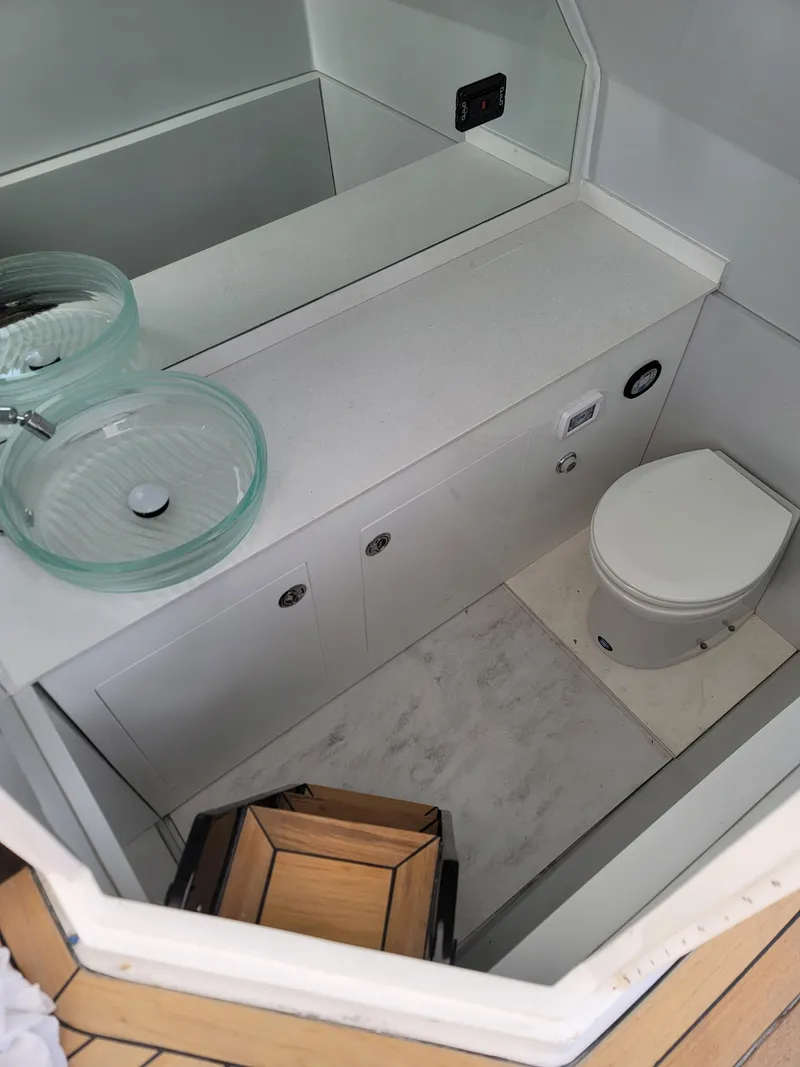 Slide: The Image of Modern bathroom in 2022 Catamaran PRJ Cat40 with glass sink and compact toilet. - 13