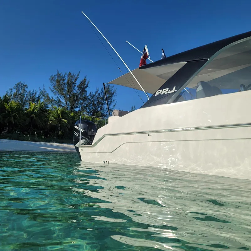 Slide: The Image of 2022 Catamaran PRJ Cat40 anchored near tropical beach with clear blue water. - 7