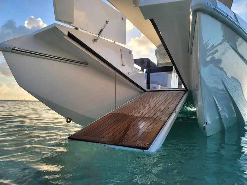 Slide: The Image of 2022 Catamaran PRJ Cat40 with open deck ramp on tranquil water. - 9