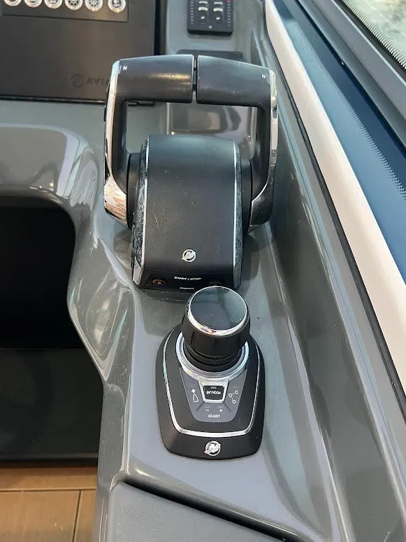 Slide: The Image of 2023 Aviara AV32 OB boat controls with sleek design and modern technology. - 10