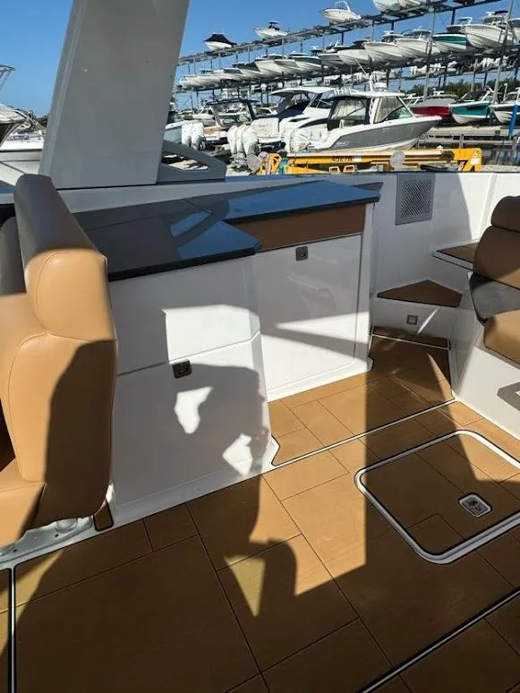 Slide: The Image of 2023 Aviara AV32 OB boat interior with tan seating and sleek design. - 11