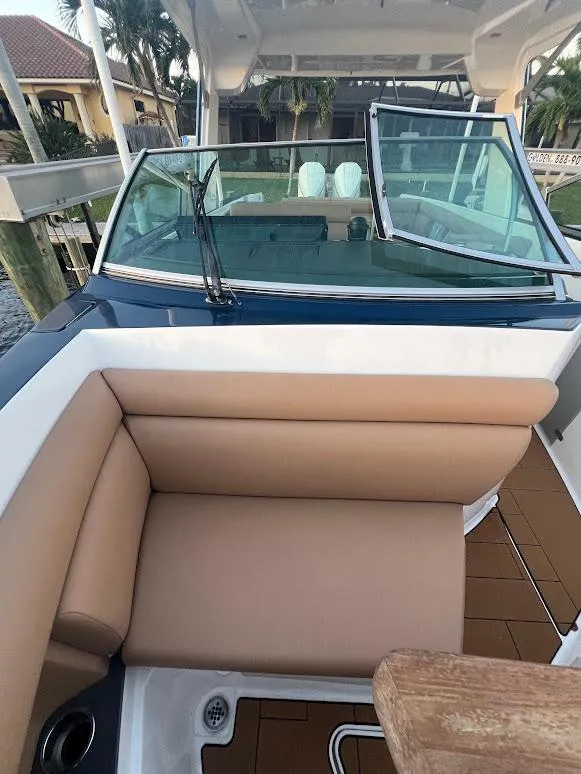 Slide: The Image of 2023 Aviara AV32 OB boat with tan seating and sleek design. - 18