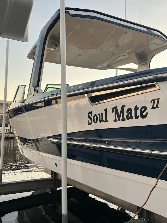 Slide: The Image of 2023 Aviara AV32 OB boat named "Soul Mate II" docked at marina. - 25