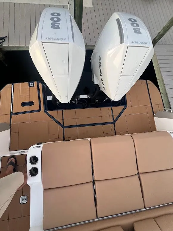 Slide: The Image of 2023 Aviara AV32 OB boat with twin outboard engines and tan seating. - 27