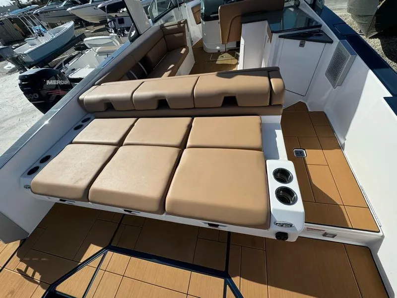 Slide: The Image of 2023 Aviara AV32 OB boat interior with tan seating and modern design. - 5