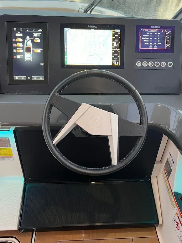 Slide: The Image of 2023 Aviara AV32 OB helm with advanced navigation displays and modern steering wheel. - 9