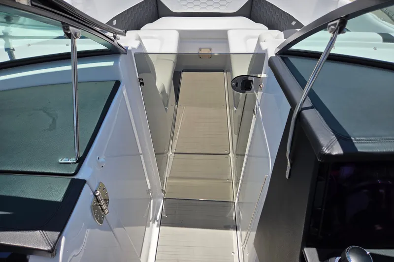 Slide: The Image of 2025 Four Winns H9 OB boat interior with sleek design and modern features. - 20