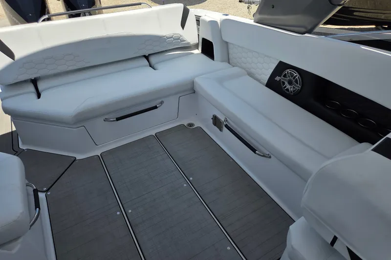 Slide: The Image of 2025 Four Winns H9 OB boat interior with white seating and modern design. - 8