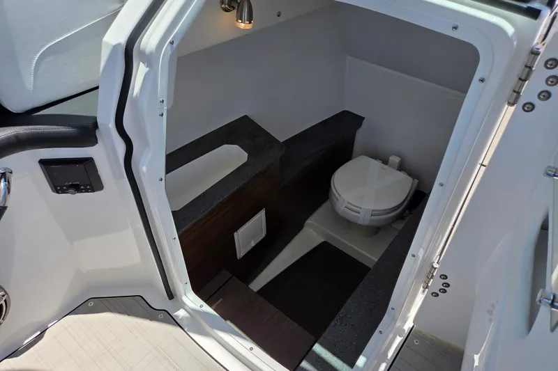 Slide: The Image of Interior view of 2025 Four Winns H9 OB boat bathroom with modern amenities. - 13