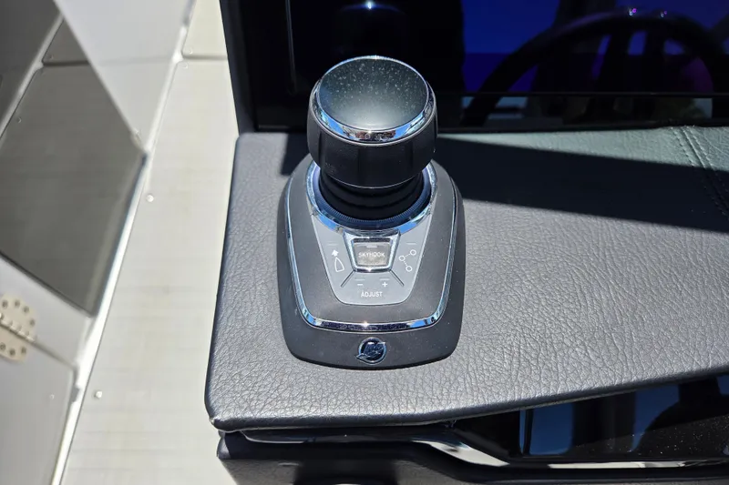 Slide: The Image of Joystick control on 2025 Four Winns H9 OB boat dashboard. - 4