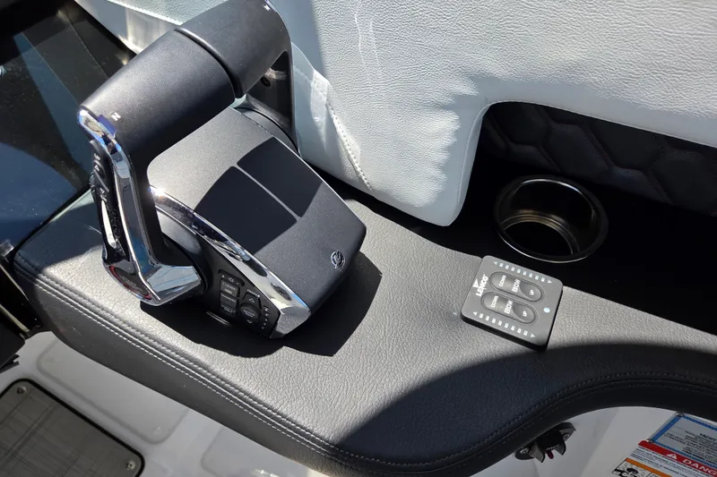 Slide: The Image of Throttle control and panel in 2025 Four Winns H9 OB boat cockpit. - 5