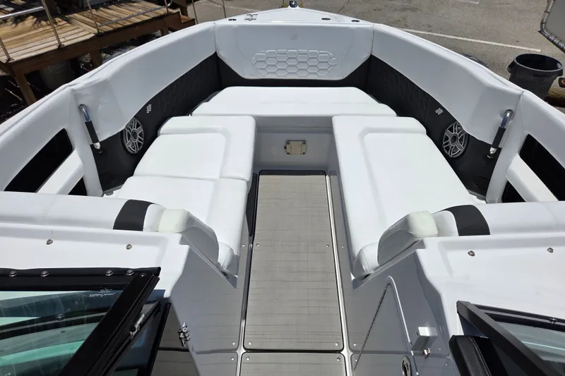 Slide: The Image of 2025 Four Winns H9 OB boat interior with white seating and modern design. - 14