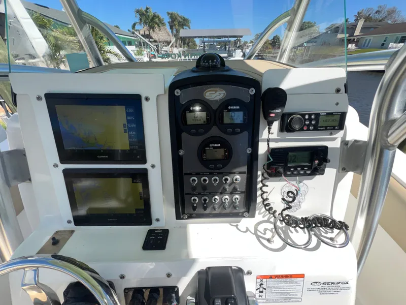 Slide: The Image of Control panel of a 2016 Sea Fox 266 Commander boat with navigation and communication equipment. - 10